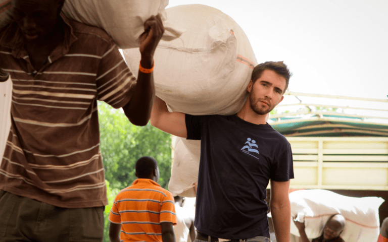 Navonel Glick, now Diptera.ai’s CEO, distributing mosquito nets in Kenya, circa 2011, for IsraAID. Photo by Mickey Noam-Alon/IsraAID