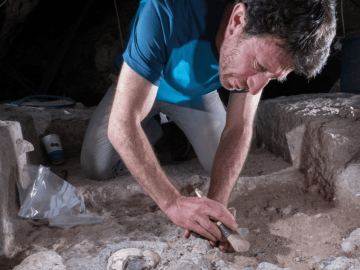 Yossi Zaidner excavating a 110-thousand year-old human skull and associated artifacts. Credit: Boaz Langford
