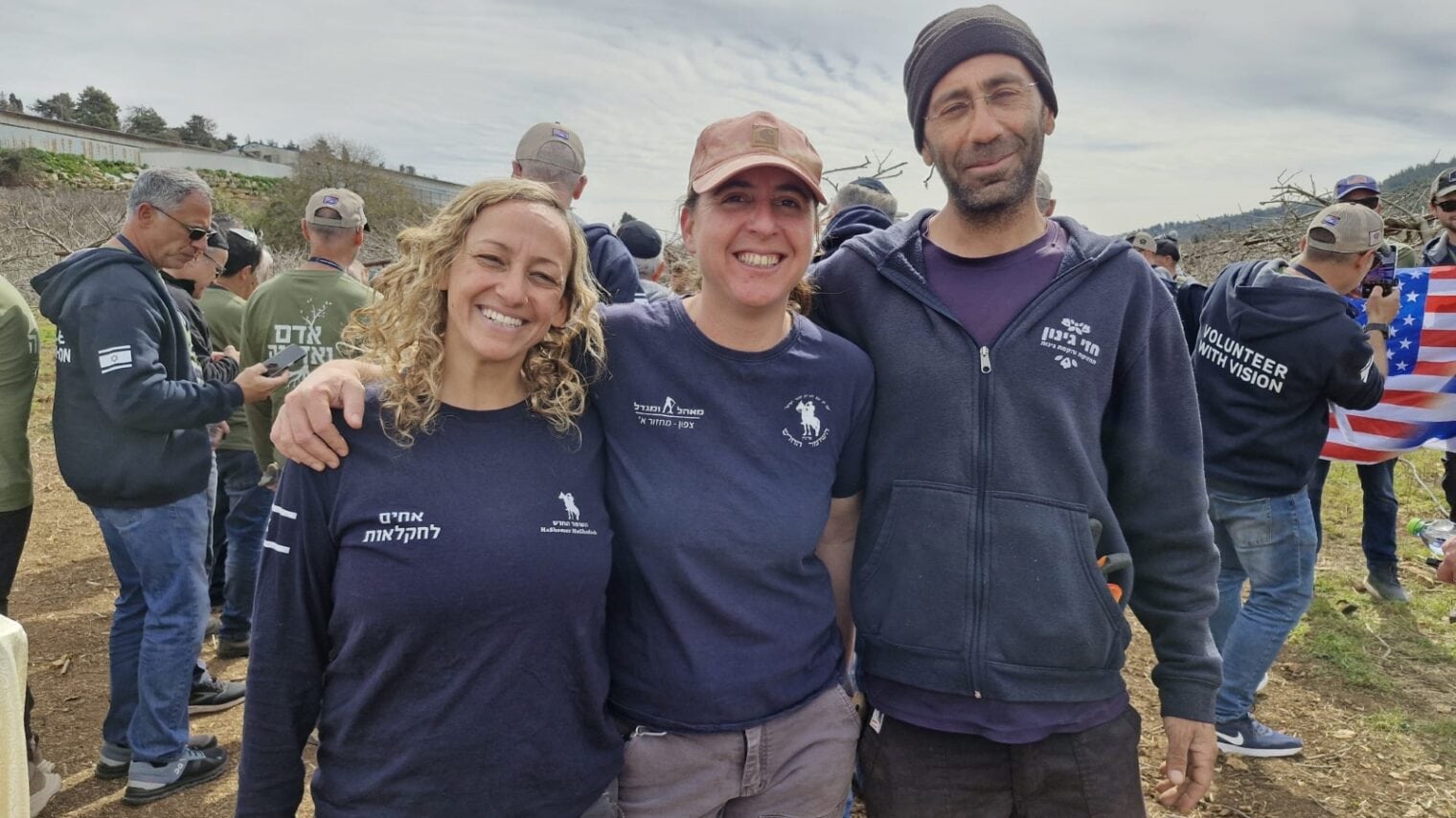 Kiwi farm owner Hezi Mena (far right) with two HaShomer HaChadash volunteers. Photo courtesy of HaShomer HaChadash