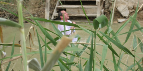 Baptism-in-polluted-Jordan-River