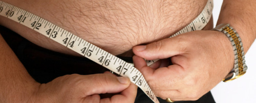 Overweight-Man-Measuring-Waist